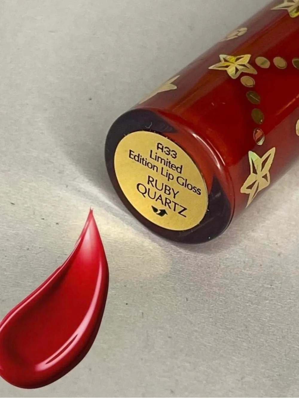 Estee Lauder Red Shimmer Lip Gloss in the beautiful Shade Ruby Quartz full size